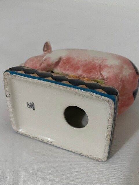 Pig salt Shaker with sunflower base. pink, blue, black and yellow